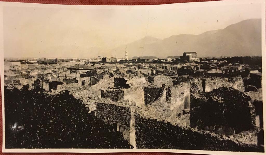 Vicolo di Mercurio, Pompeii, lower part of photo. Photo from album dated 1928. 
Looking south-east across VI.14, with bakery at VI.14.34, in centre, and rear room of VI.14.35/36, on right. 
Photo courtesy of Rick Bauer.
