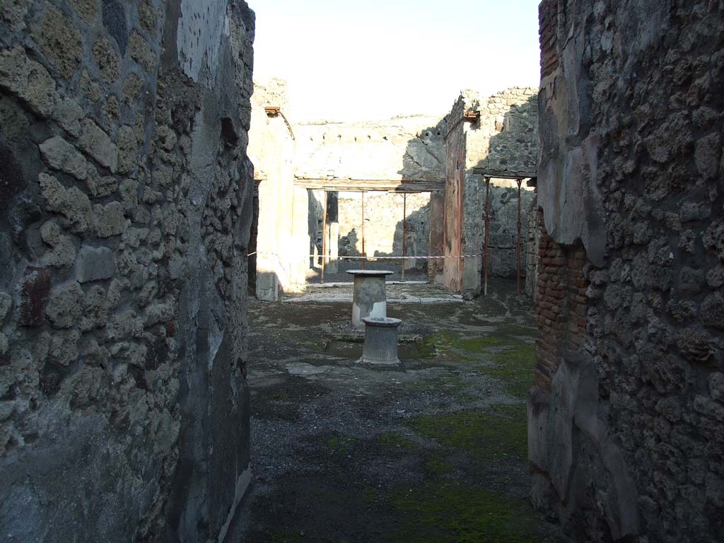 VI.14.40 Pompeii. December 2007. Looking east from fauces or entrance corridor, across atrium to tablinum.  According to Garcia y Garcia, this house also had two rooms hit  by the 1943 bombardment, with the loss of IV style painting. See Garcia y Garcia, L., 2006. Danni di guerra a Pompei. Rome: L’Erma di Bretschneider. (p.93, with two photos by Tatiana Warscher, pre 1943 on p.94).
 