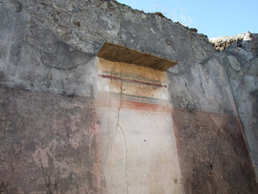 VI.14.43 Pompeii. December 2007. Doorway to room 16, exedra on north side of peristyle.
Found on the north wall according to Schefold, (1957) was a painting of Pindar and Corinna ?  Schefold said in 1962, that the painting had been transferred to Naples Archaeological Museum, Pindar, Myrtis and Corinna.
See Schefold, K., 1962. Vergessenes Pompeji. Bern: Francke. (Pl. 57, 2) 
According to Richardson, the wall painting of Pindar and Corinna, found on the north wall, had the inventory number NAP 9269. He also gave the Helbig reference as Helbig 1379.
See Richardson, L., 2000. A Catalog of Identifiable Figure Painters of Ancient Pompeii, Herculaneum. Baltimore: John Hopkins. (p.67). 
However NAP 9269 is a painting of Bacchus and Silenus, from VII.7.32, and according to Elia the painting of Pindar, Myrtus and Corinna was inventory number: s.n (senza numero).
See Elia, O. (1932): Pitture murali e mosaici nel Museo Nazionale di Napoli. Rome: La Libreria dello Stato. (p.14, no.5: Gara di citaredo).
According to Helbig the exedra, left from peristyle, contained a painting of: Gods (deification of) of Homer. This had the same number as the above.
See Helbig, W., 1868, Wandgemälde der vom Vesuv verschütteten Städte Campaniens.  Leipzig: Breitkopf und Härtel.  (1379).

