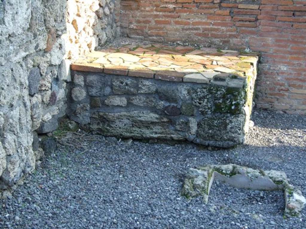 VI.14.44 Pompeii. December 2007. Base of steps to upper floor or bench or counter?