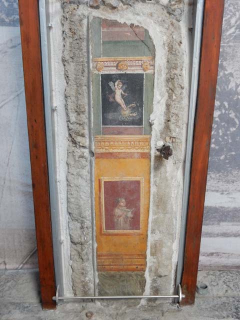 VI.15.1 Pompeii. May 2017. Detail of painted panel on west wall of atrium, leading onto peristyle. Photo courtesy of Buzz Ferebee.
