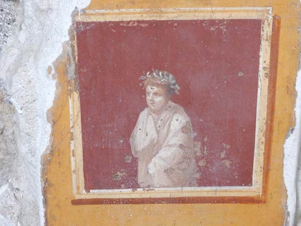 VI.15.1 Pompeii. June 2019.  
Detail of painting in atrium between doorways to bedroom on left of main entrance and oecus on south side. 
Photo courtesy of Buzz Ferebee.
