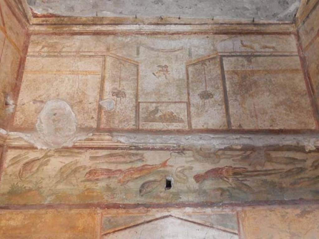 VI.15.1 Pompeii. May 2017. Detail from frieze at north end of east wall of bedroom on left of main entrance. Photo courtesy of Buzz Ferebee.
