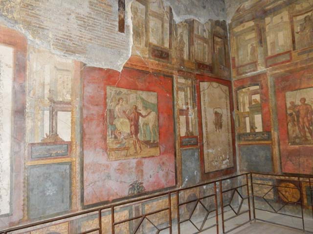 VI.15.1 Pompeii. May 2017. Looking towards the east wall, on either side of the central panel were painted panels. On the left (north side) painted food was shown, with mask above. On the right (south side) painted drinks were shown, with mask above.  Photo courtesy of Buzz Ferebee.
