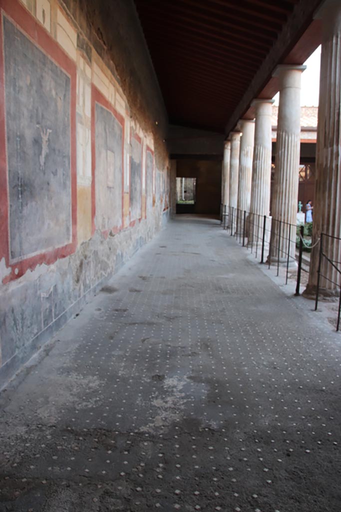 VI.15.1 Pompeii. October 2023. 
Looking north along west portico of peristyle. Photo courtesy of Klaus Heese.

