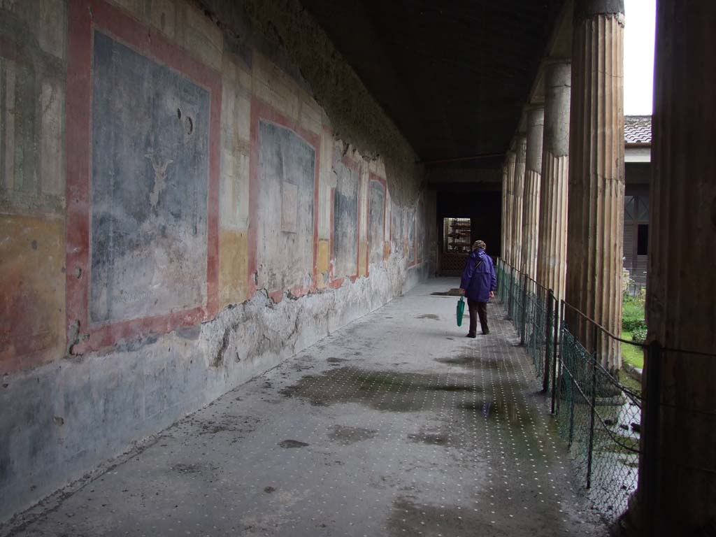 VI.15.1 Pompeii. December 2006. Looking north along west portico of peristyle.