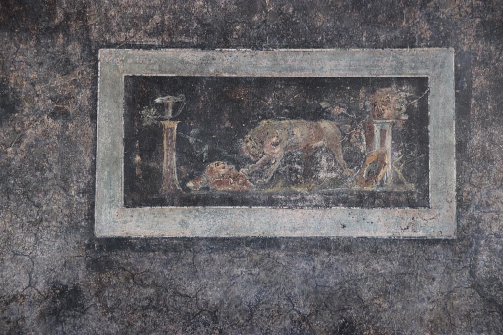 VI.15.1 Pompeii. October 2023. Detail of painted panel from west wall of peristyle near south-west corner.