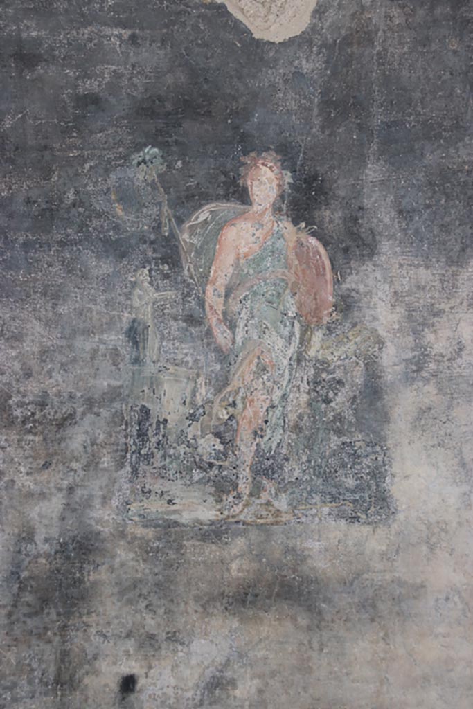 VI.15.1 Pompeii. October 2023. 
Painting of Maenad with small statue of Bacchus, from west wall of peristyle. Photo courtesy of Klaus Heese.
