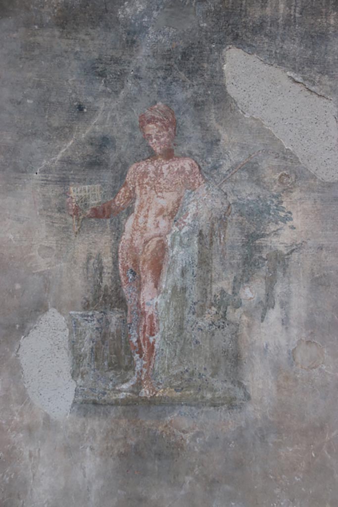 VI.15.1 Pompeii. October 2023.
Painting of figure from west wall of peristyle. Photo courtesy of Klaus Heese.
