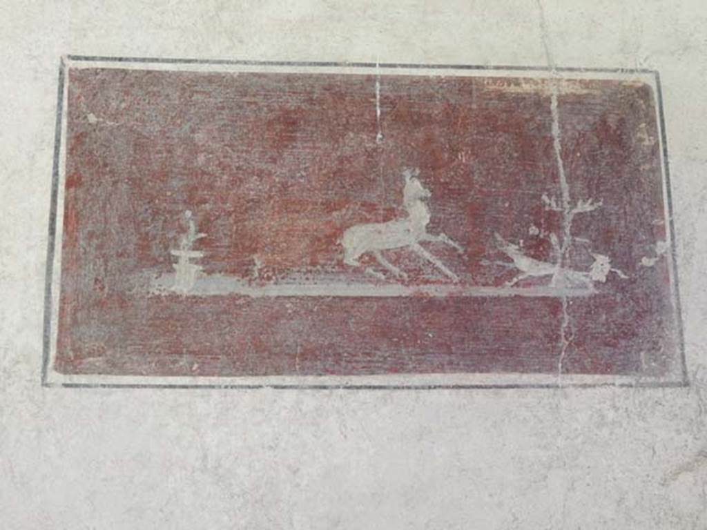 VI.15.8 Pompeii. May 2010. Painted panel of hunting scene on north wall of tablinum.