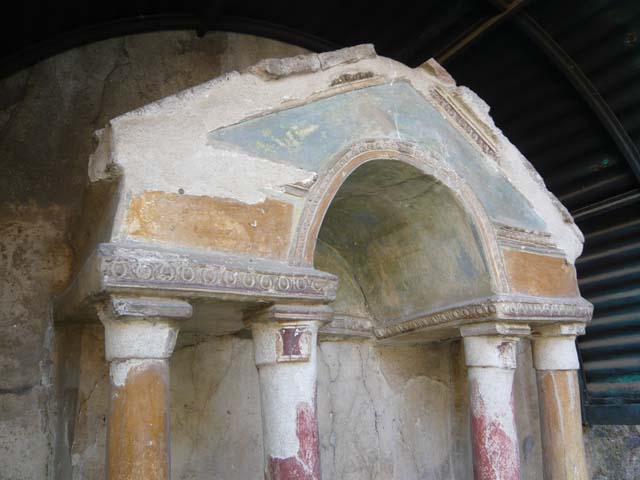 VI.15.8 Pompeii. May 2012.  Painted columns and pediment on household shrine in the garden. Photo courtesy of Buzz Ferebee.
