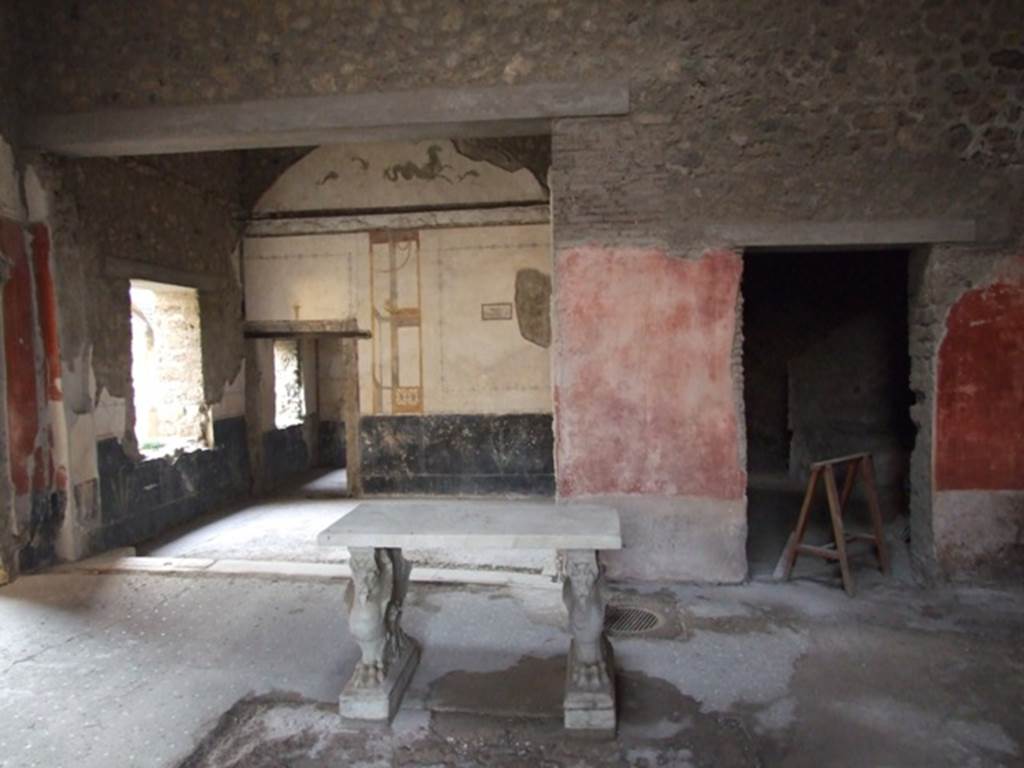 VI.15.8 Pompeii. December 2018. 
Looking west across impluvium in atrium towards tablinum and doorway to kitchen, on right. Photo courtesy of Aude Durand.
