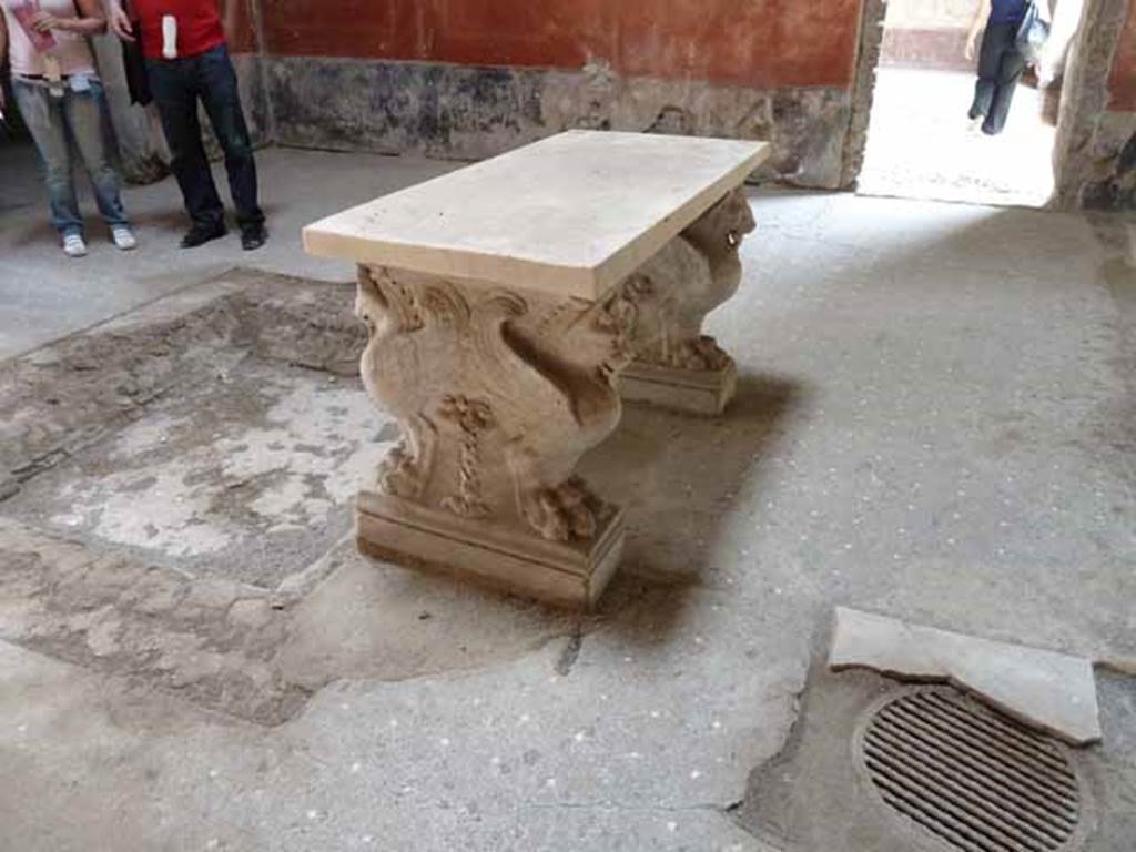 VI.15.8 Pompeii. May 2015. Marble table leg at west end. Photo courtesy of Buzz Ferebee.