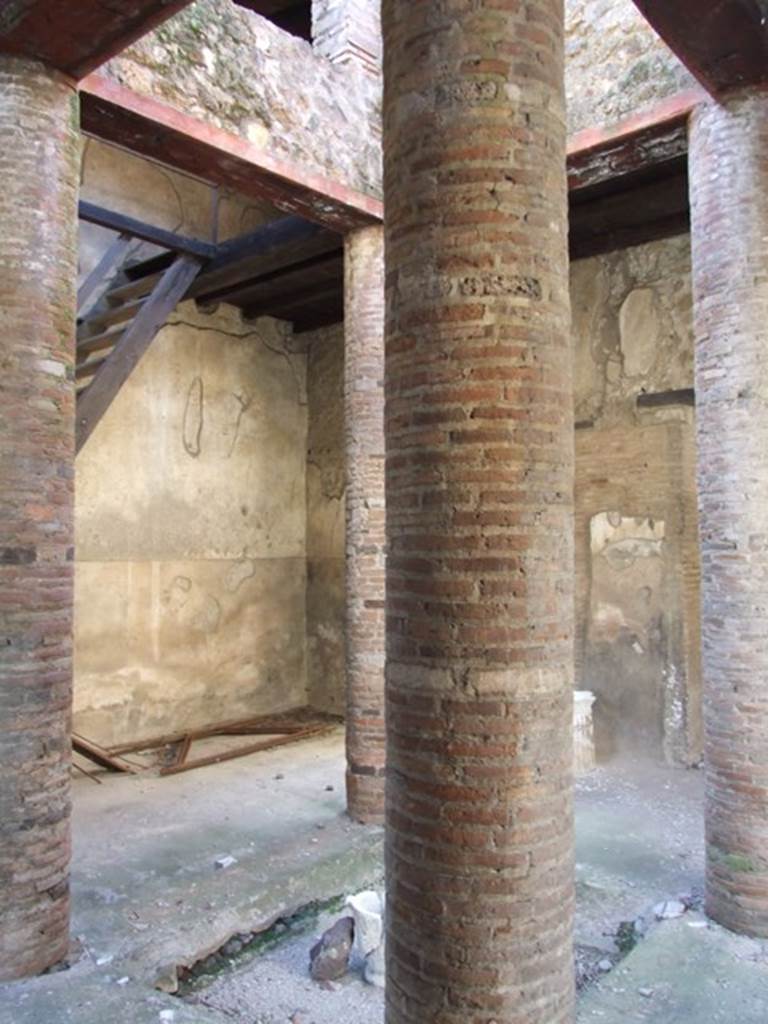 VI.15.9 Pompeii. March 2009. Looking west along north side of atrium towards triclinium with window.

