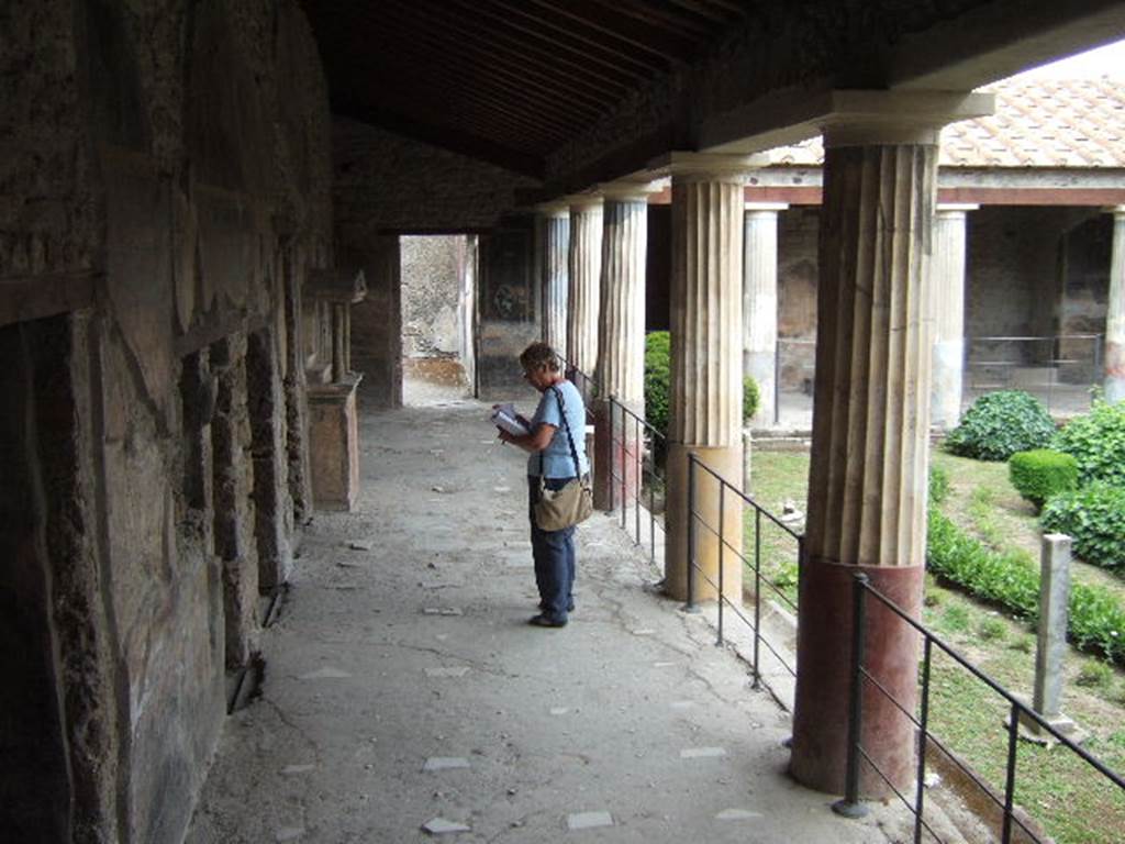 VI.16.7 Pompeii. June 2013. Looking east along north portico, with doorways to rooms M, L, K and J.
Photo courtesy of Buzz Ferebee.
