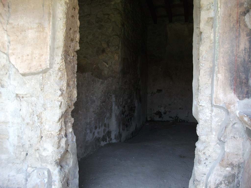 VI.16.7 Pompeii. May 2010. Doorway to room J, stairs to upper floor. Looking north.