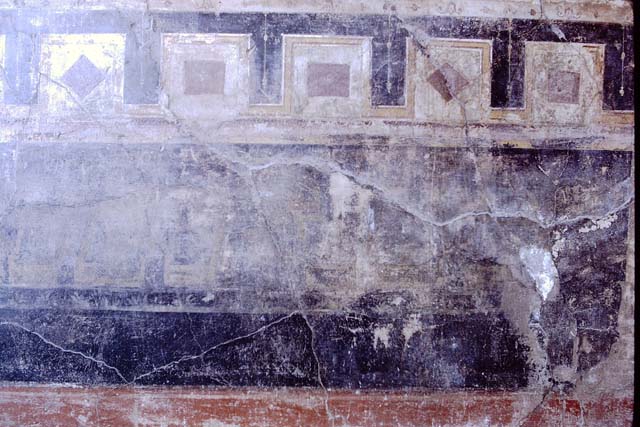 VI.16.7 Pompeii.  May 2006. Room E, tablinum. Detail of coloured mosaic in door threshold.