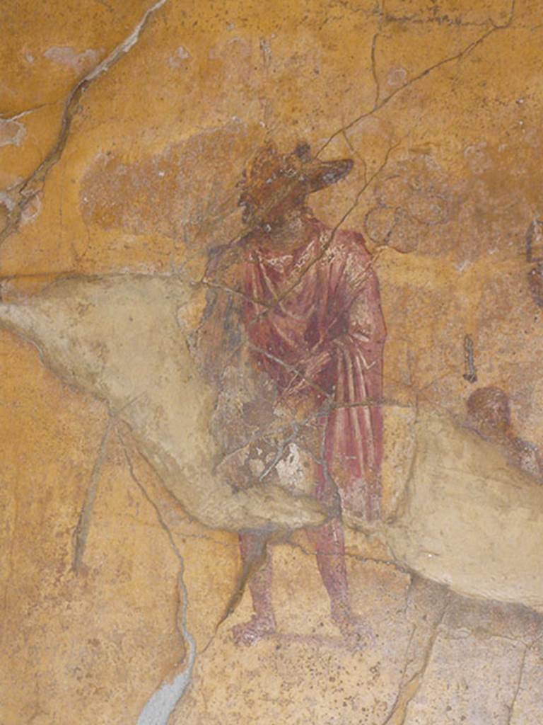 VI.16.7 Pompeii. May 2016. Room F, detail of painting of Anubis, small figure, and Isis. Photo courtesy of Buzz Ferebee.

