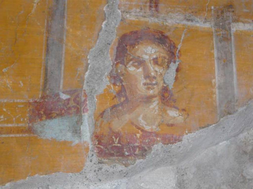VI.16.7 Pompeii. June 2013. Room N, painting of face on east end of north wall, after restoration.
Photo courtesy of Buzz Ferebee.
