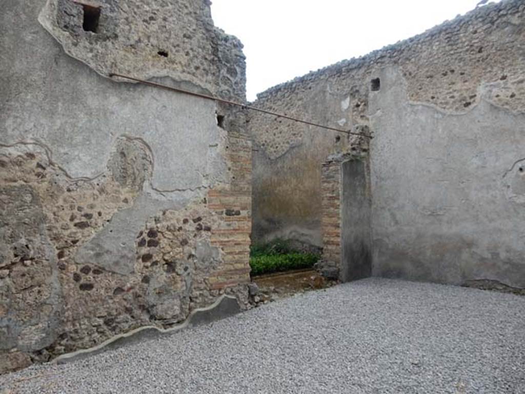 VI.16.7 Pompeii. May 2016. Room O, south wall with doorway to room P, the light-yard. Photo courtesy of Buzz Ferebee.
