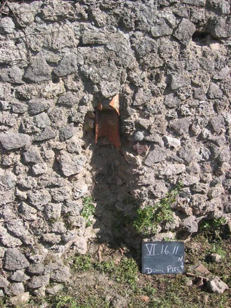 VI.16.11Pompeii. July 2008. Downpipe in south wall. Photo courtesy of Barry Hobson