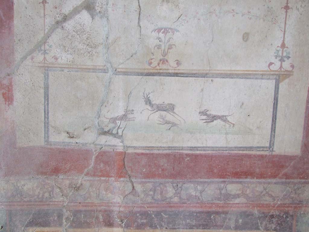 VI.16.15 Pompeii. December 2006. South wall of small tablinum D, showing detail of wall painting of stag hunt with dogs. 
