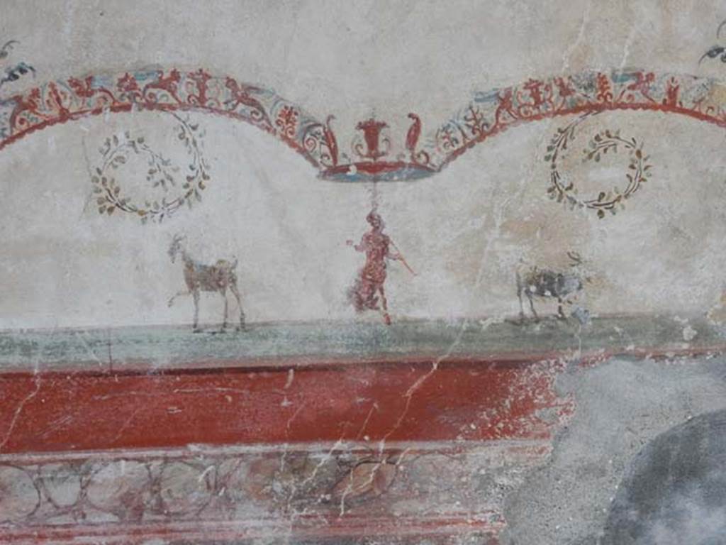 VI.16.15 Pompeii. May 2015. Tablinum D, detail of wall painting of figure and two goats from below central painting. Photo courtesy of Buzz Ferebee.
