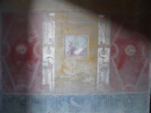 VI.16.15 Pompeii. December 2006. North end of east wall of room F with detail of wall painting of panther and mask of Oceanus.