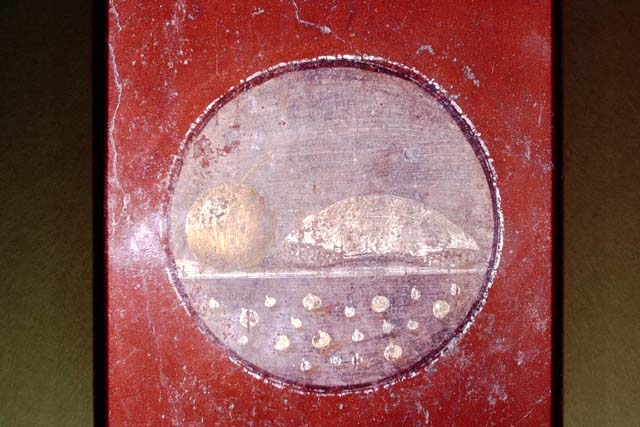 VI.16.15 Pompeii. December 2006. Medallion on south end of east wall of room F with painting of food.