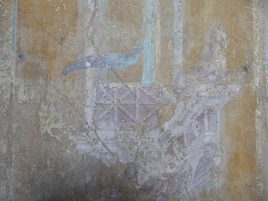 VI.16.15 Pompeii. December 2006. North wall of room G with detail of architectural wall painting with peacock and sea creature.