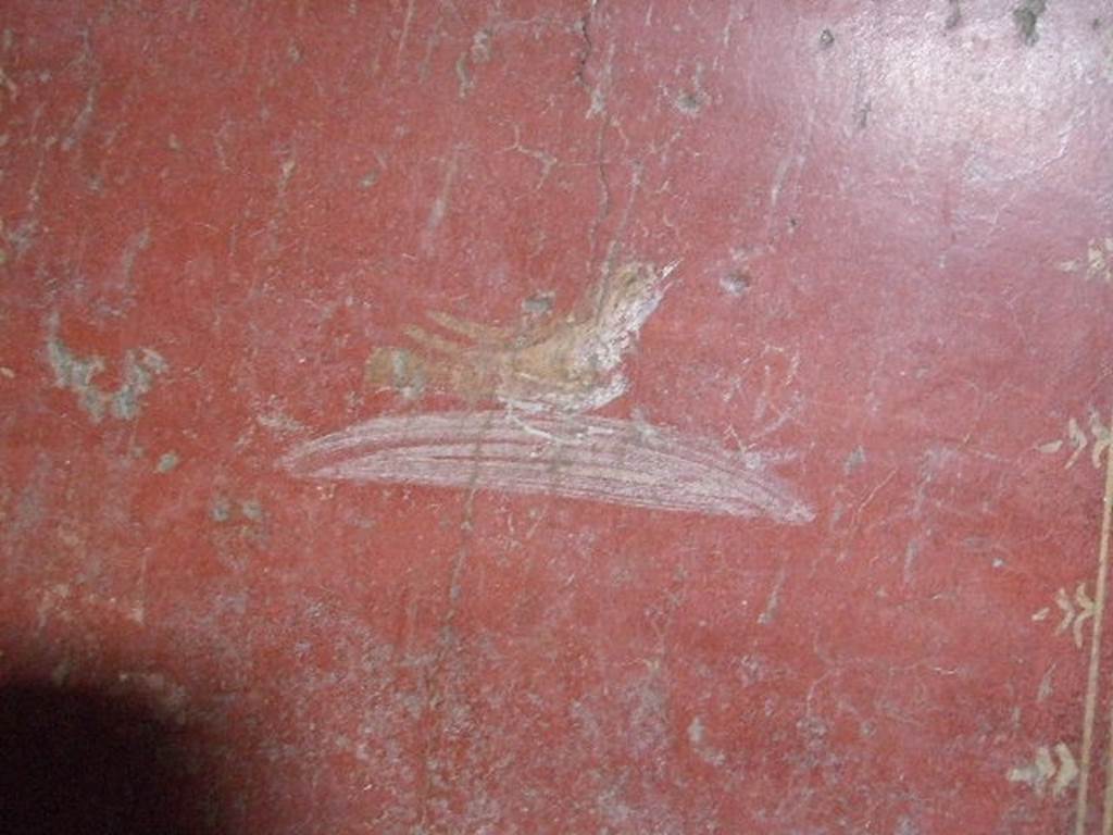 VI.16.15 Pompeii. December 2006. Wall painting of bird at south end of west wall in room H.   
