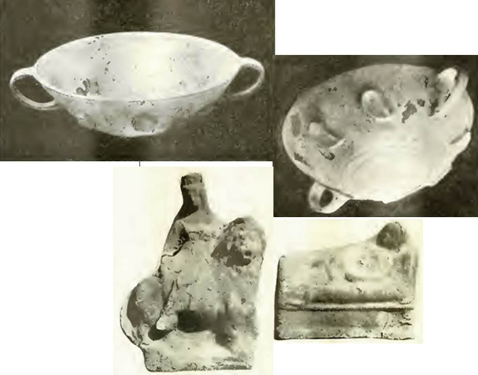 VI.16.28 Pompeii. 1908. Room F, tablinum, some of the finds from the tablinum. A pair of glass cups, mould-blown, with formal decoration in relief and each with two handles.
A terracotta statuette of Venus sitting on a lion. A terracotta statuette of a Lar lying on a bed. Now in Naples Archaeological Museum.  One glass cup is Inventory number 133273.
See Notizie degli Scavi di Antichità, 1908, p. 276-8, figs 4, 4a, 5 and 6. See Ward Perkins, J. and Claridge A., 1976. Pompeii AD 79.  London: Westerham. (No. 116)
