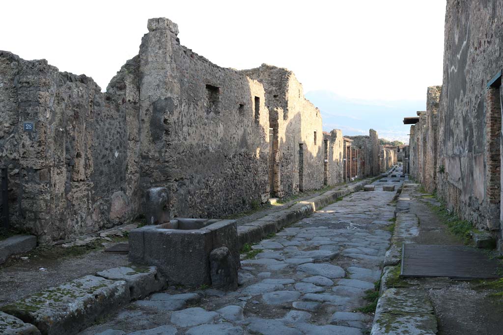 VI.16.28 Pompeii, on left. December 2018. 
Looking south on Vicolo dei Vettii between VI.16.28, on left, and VI.15, on right. Photo courtesy of Aude Durand.
