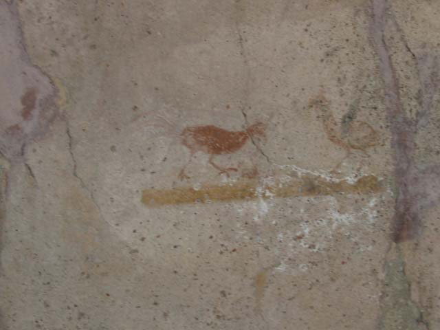 VI.16.33 Pompeii. May 2003. Painting of bird with two cherries in its beak, from centre of north wall. Photo courtesy of Nicolas Monteix.
