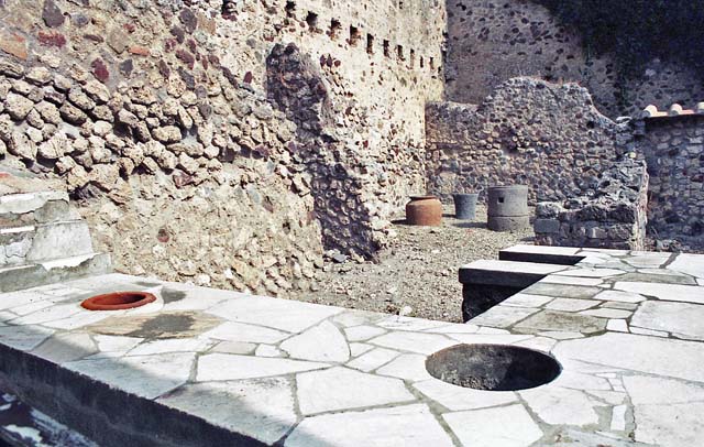 VI.16.40 Pompeii. October 2001. Looking north-east across counter in bar-room towards rear rooms. Photo courtesy of Peter Woods.
