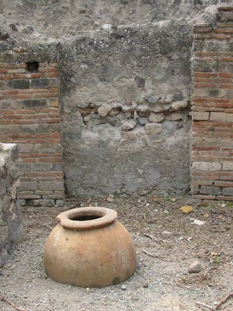 VI.16.40 Pompeii. December 2018. Room F, looking towards west wall with painted lararium. 
Corridor E, leading to bar-room, is on the left. Photo courtesy of Aude Durand.

