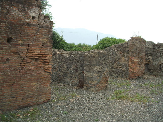 VI.17.1 Pompeii. May 2005. Looking south-west from entrance, towards rooms on south side.