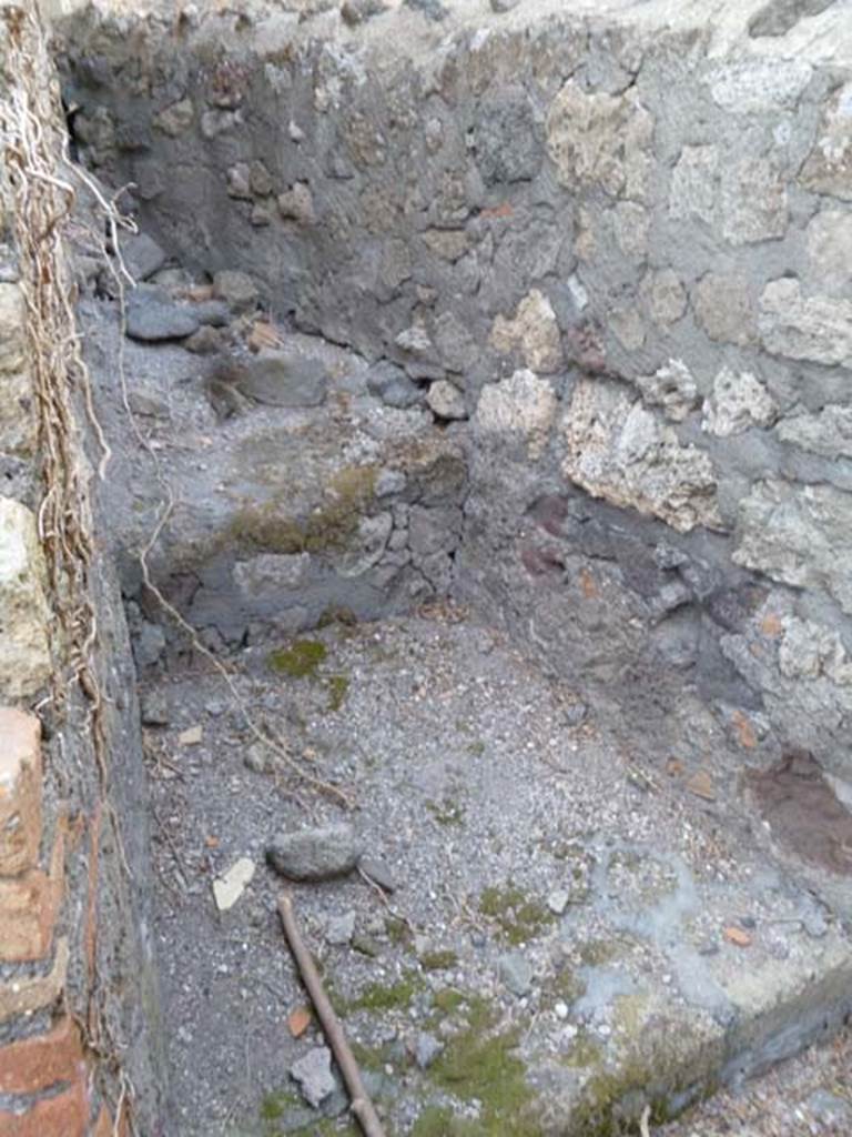 VI.17.1 Pompeii. May 2011. Looking north towards hearth on north side of entrance doorway.