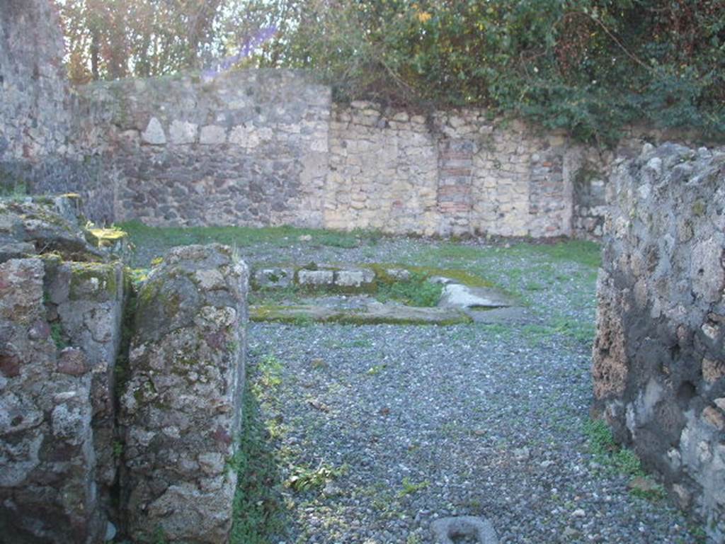 VI.17.16 Pompeii. December 2004. Looking west along fauces towards atrium.
In the rear wall are two blocked doorways of which the one (on the right) would have led into a corridor leading to steps down.

