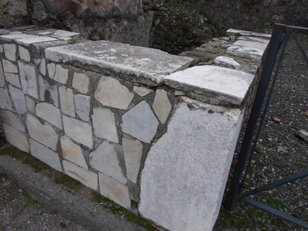 VI.17.31 Pompeii. December 2007. Sales podium/bench faced with marble slabs. 