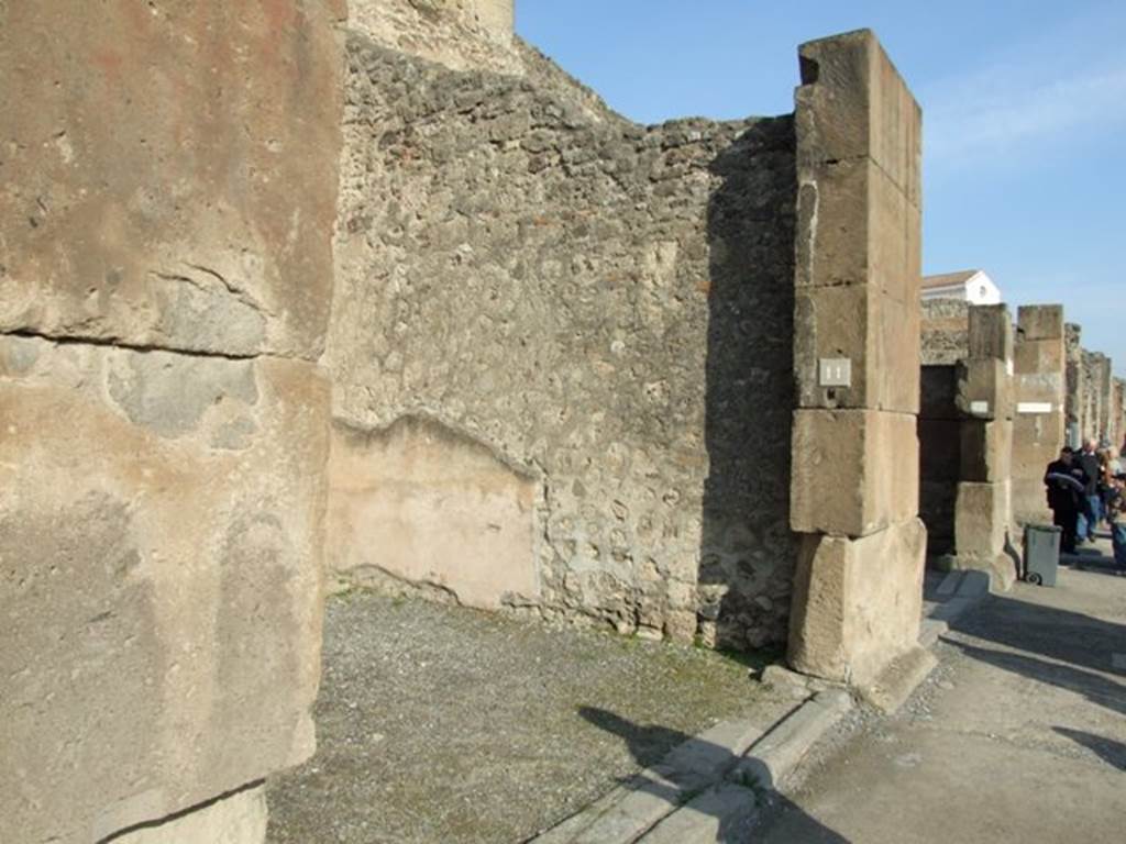 VII.1.11 Pompeii. December 2007. Entrance. Graffiti, painted in red, was found in August 1853, between VII.1.11 and 12, it read

Holconium
Priscum
II vir(um)  i(ure)  d(icundo)    [CIL IV 767a]
Now in Naples Archaeological Museum.  Inventory number 4723.

M(arcum)  Epidium  Sabinum  d(uumvirum)  i(ure)  dic(undo)  o(ro)  v(os)  f(aciatis)  dig(nus)  est
defensorem  coloniae  ex  sententia  Suedi  Clementis  sancti  iudicis
consensu  ordinis  ob  merita  eius  et  probitatem  dignum  rei  publicae  faciat
Sabinus  dissignator  cum  Plausu  facit       [CIL IV 768]

See Pagano, M. and Prisciandaro, R., 2006. Studio sulle provenienze degli oggetti rinvenuti negli scavi borbonici del regno di Napoli.  Naples : Nicola Longobardi.  (p.169)
