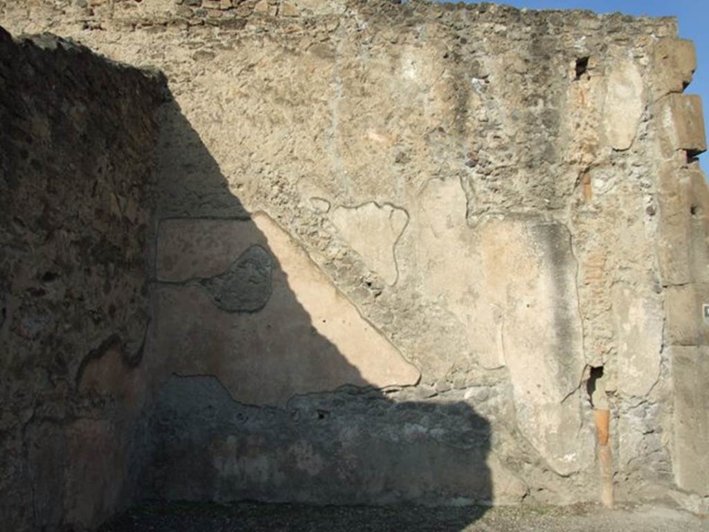VII.1.12 Pompeii. December 2007.  North wall with outline of staircase in plaster and waste pipe from upper floor.
