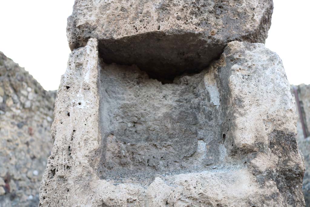 VII.1.18 Pompeii. December 2018. Detail of niche/recess in pilaster on north side of entrance doorway. Photo courtesy of Aude Durand.