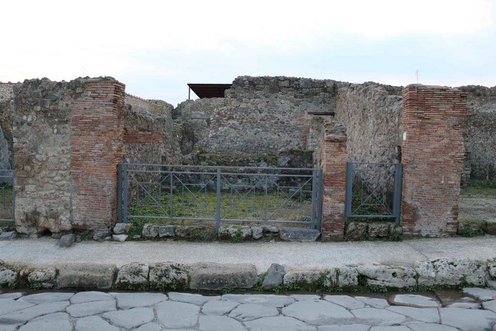 VII.1.28 Pompeii, centre left. December 2018. 
Looking west to entrance doorway, including steps to upper floor at VII.1.29, on right of it. Photo courtesy of Aude Durand.


