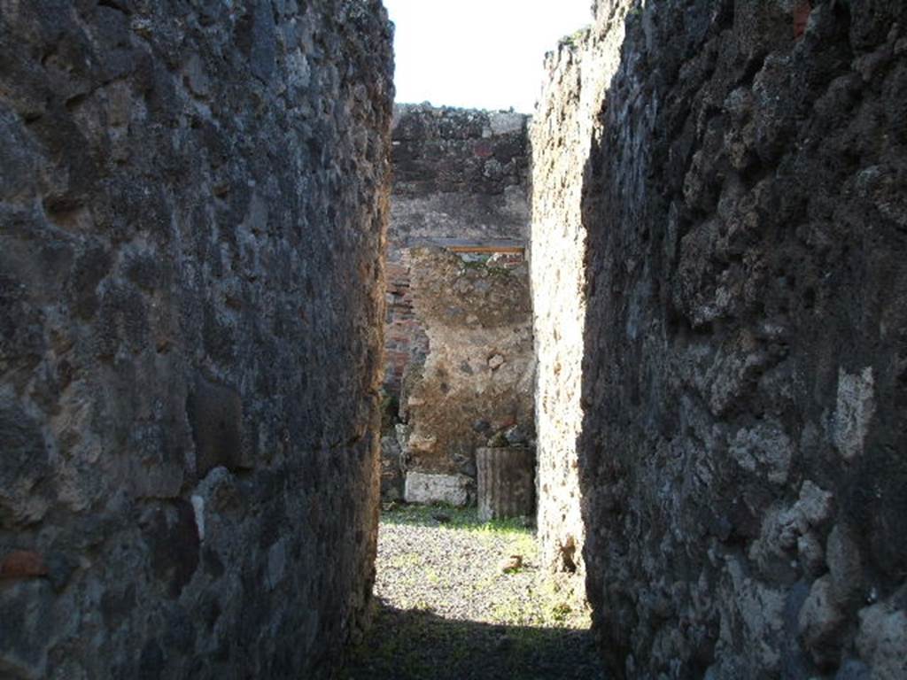 VII.1.30 Pompeii. December 2004.  Looking west along long entrance corridor. According to Fiorelli, a corridor led from the street to a stable, which was partly covered with a roof, and had a long podium for use as a manger.

