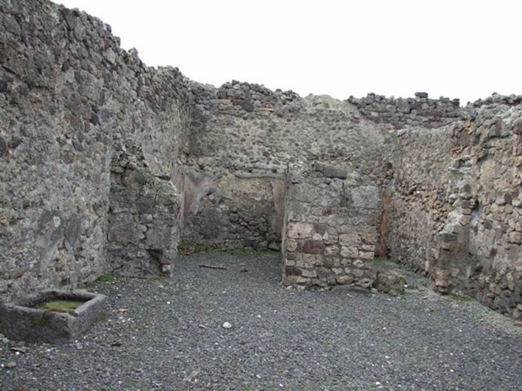 VII.1.31 Pompeii. December 2007.   West wall with two rear rooms with outline of staircase on rear wall in room on left, which also contained the latrine.
