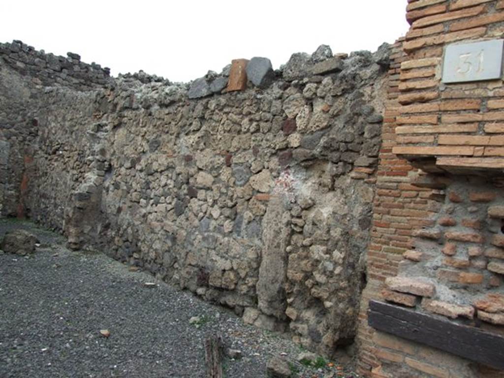 VII.1.31 Pompeii. December 2007. North wall of shop and cubculum, at rear.