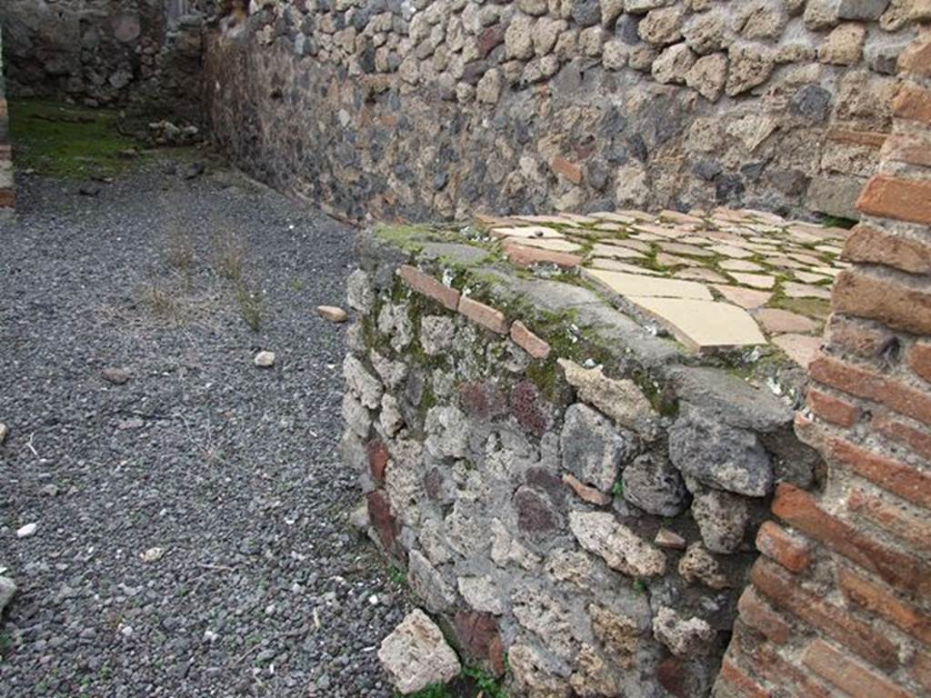 VII.1.32 Pompeii. December 2006. Hearth on north side of caupona near entrance pilaster.
