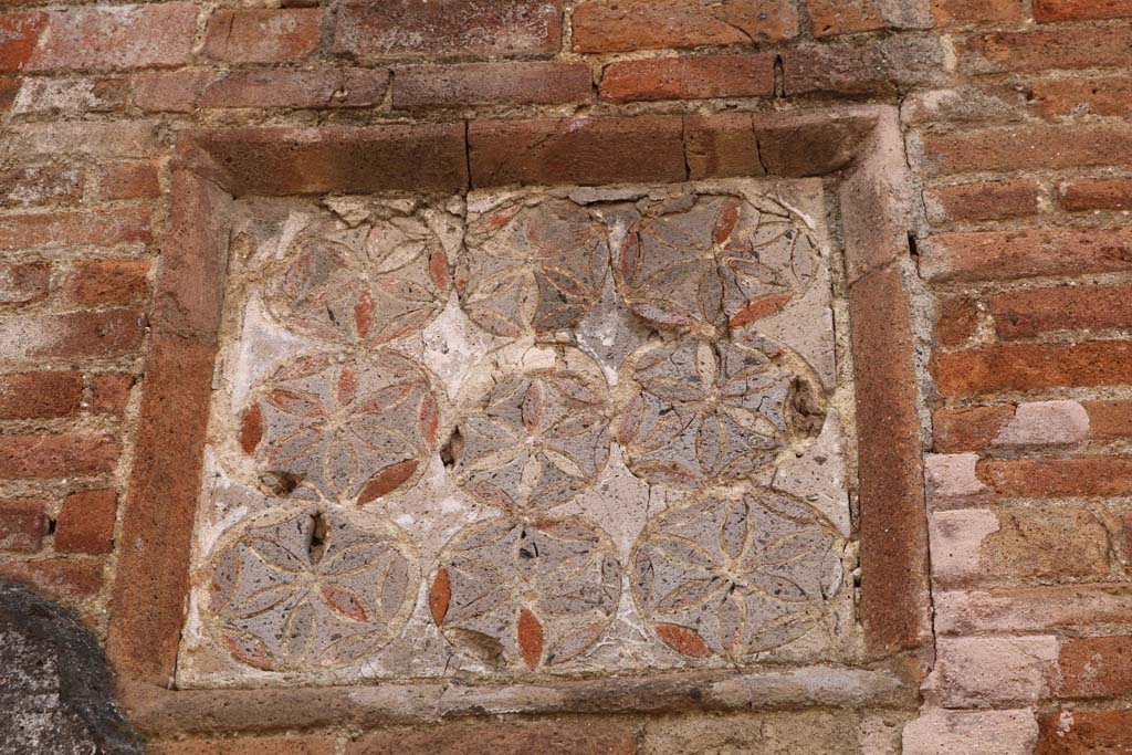 VII.1.36 Pompeii. December 2018. Detail of geometric plaque. Photo courtesy of Aude Durand.


