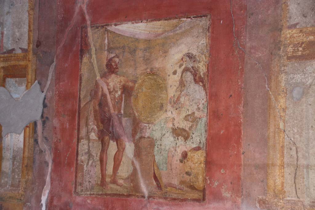 VII.1.47 Pompeii. May 2017. Exedra 10, east wall.
Wall painting of Thetis at the forge of Hephaestus receiving the shield for Achilles. 
Behind Thetis is another figure (Fate or Destiny?). 
Photo courtesy of Buzz Ferebee. 
See Carratelli, G. P., 1990-2003. Pompei: Pitture e Mosaici: Vol. VI.  Roma: Istituto della enciclopedia italiana, p. 279. 
